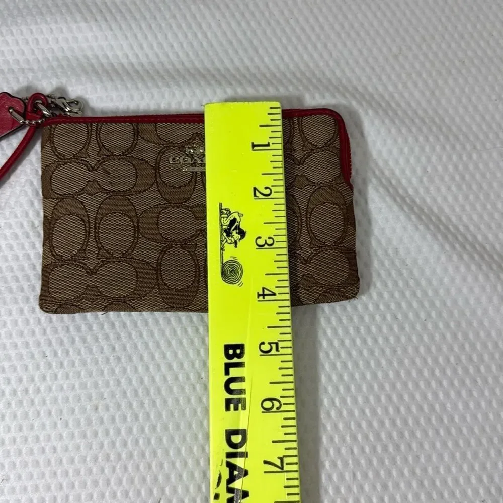 Coach tan and red Wristlet with Logo Pattern